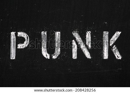 The word Punk in stencil letters on a used blackboard. The name for a ...