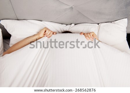 bed under hiding funny man sheets shutterstock afraid