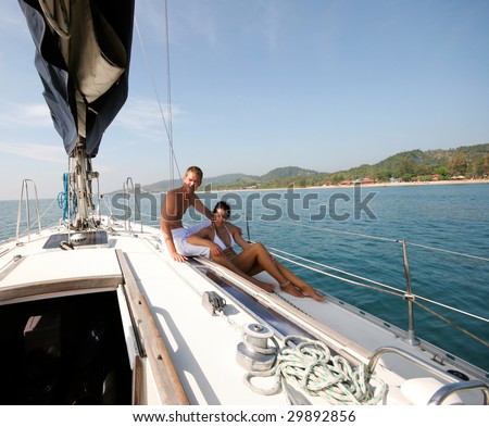 http://thumb9.shutterstock.com/display_pic_with_logo/53073/53073,1241794878,2/stock-photo-happy-couple-relaxing-on-a-luxury-yacht-29892856.jpg