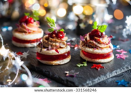 Festive appetizer with foie gras, cranberry chutney and jelly