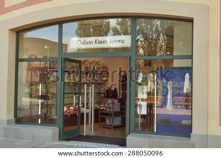 MUGELLO, ITALY - SEPTEMBER 11, 2014: Facade of Calvin Klein Jeans store in McArthurGlen Designer Outlet Barberino. Calvin Klein Inc. is an American fashion house headquartered in Manhattan, New York.