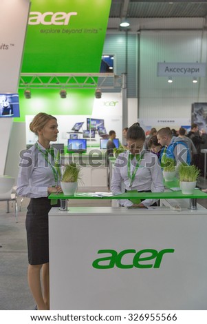 KIEV, UKRAINE - OCTOBER 11, 2015: Presenters work on Acer, a Taiwan based international computer company booth during CEE 2015, largest electronics trade show of Ukraine in ExpoPlaza Exhibition Center