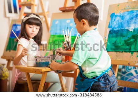 group of kids working on a painting of a landscape during art class at school - Pictures Of Kids Painting group of kids working on a painting of a landscape during art class at school - Pictures Of Kids Painting