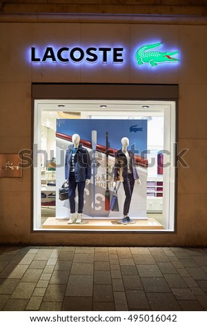 GENEVA, SWITZERLAND - NOVEMBER 18, 2015: a shop window at night. A shop window is a window in a shop displaying items for sale or otherwise designed to attract customers to the store.