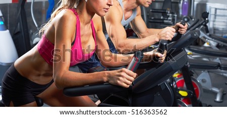 people on elliptical trainer