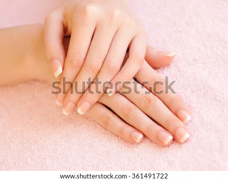 Woman hands with beautiful french manicure