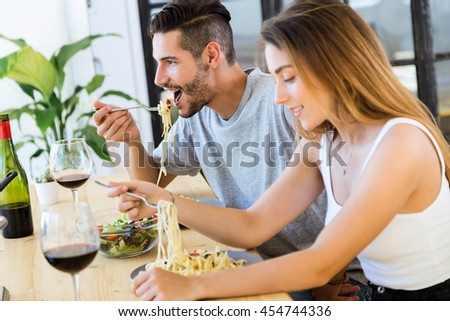 https://thumb9.shutterstock.com/display_pic_with_logo/559861/454744336/stock-photo-portrait-of-happy-couple-dining-and-drink-wine-at-home-454744336.jpg