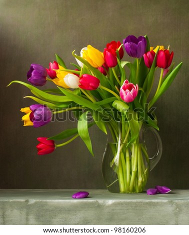 Still life with colorful tulips - stock photo