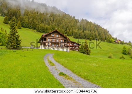 Swiss Mountain House beautiful swiss mountain valley landscape house stock photo Swiss Mountain House beautiful swiss mountain valley landscape house stock photo