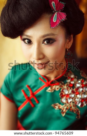 https://thumb9.shutterstock.com/display_pic_with_logo/570949/570949,1328813029,2/stock-photo-woman-wearing-a-cheongsam-chinese-classical-costumes-94765609.jpg