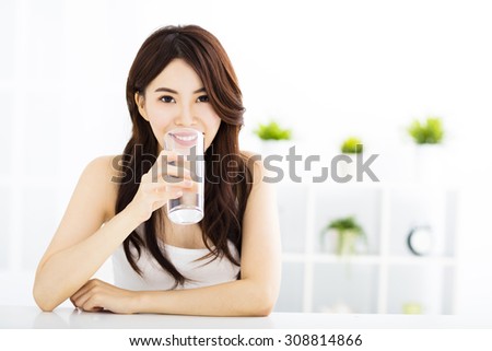 Young attractive woman with clean water
