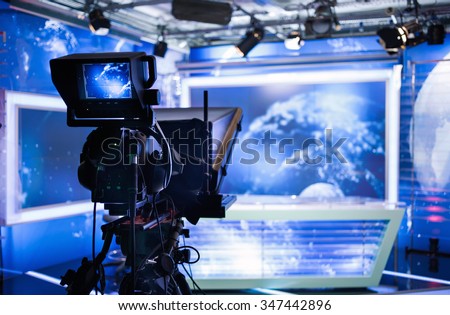 Video camera - recording show in TV studio - focus on camera