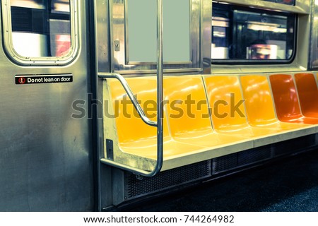 New York City subway interior with colorful seats