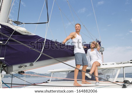 https://thumb9.shutterstock.com/display_pic_with_logo/580507/164882006/stock-photo-attractive-couple-standing-on-a-sailing-boat-love-164882006.jpg