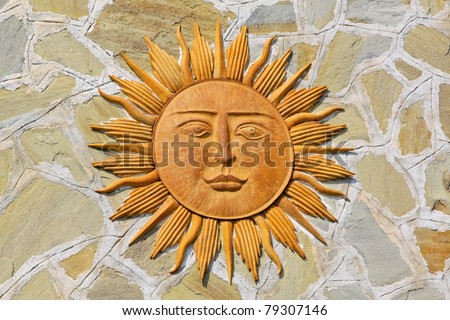 Close up shot of sun with face and rays - stock photo