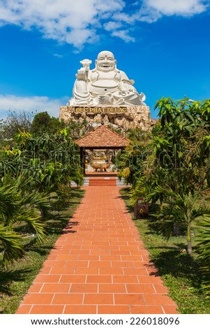 VUNG TAU, VIETNAM - JANUARY 2014: Buddha statue at top of a hill