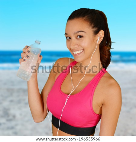 https://thumb9.shutterstock.com/display_pic_with_logo/59689/196535966/stock-photo-woman-standing-on-the-beach-doing-a-workout-196535966.jpg