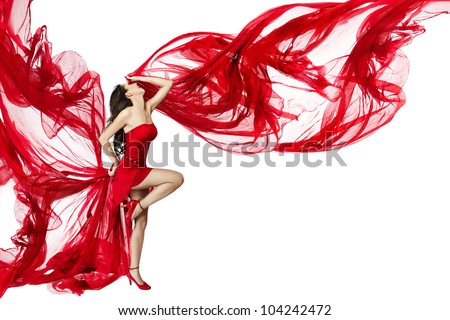 Woman in red dress flying on a wind flow dancing over white background - stock photo