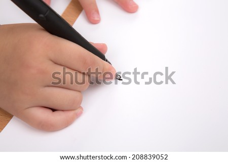 Preschool age child writing