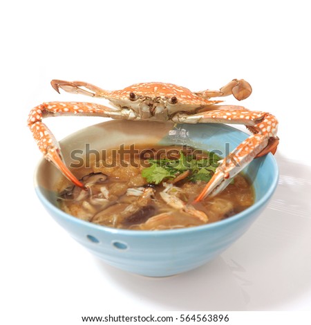Braised fish maw in red gravy abalone mushroom with crab meat, The presentation of the more interesting and difference on with steamed crab was placed on top, Macro photo focus select at center.