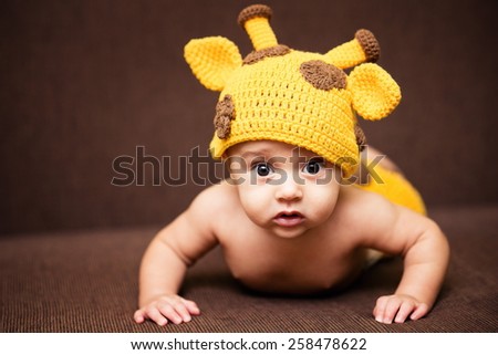 Baby Boy In A Funny Giraffe Hat
