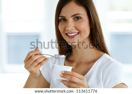Healthy Lifestyle. Portrait Of Beautiful Sexy Smiling Woman Tasting Fresh Organic Yogurt. Charming Cheerful Girl On Diet Nutrition Eating Delicious Natural Yoghurt, Dairy Food. High Resolution