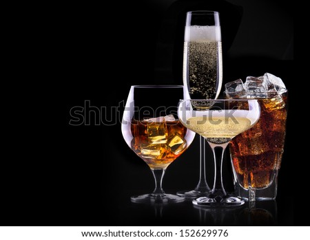 set with different drinks on black background - champagne,cola,cocktail,wine,brandy,whiskey,scotch,vodka,cognac - stock photo