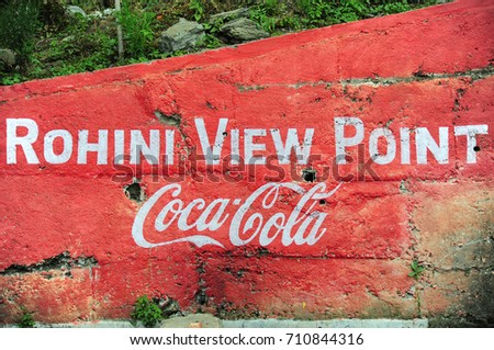 ROHINI, INDIA - APRIL 16: Painted of Rohini View Point and Coca-Cola logo on the wall on April 16, 2016, Rohini View Point is a small stop point during the way from Darjeeling to Sikkim, India