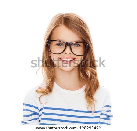 education, school and vision concept - smiling cute little girl with ...