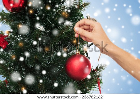People Decorating For Christmas christmas decorating hand over tree stock images, royalty-free People Decorating For Christmas christmas decorating hand over tree stock images, royalty-free