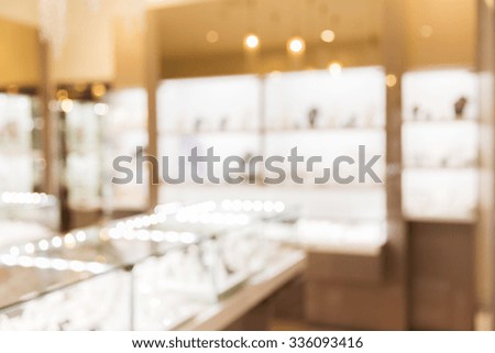 sale, consumerism, shopping and background concept - jewelry store blurred bokeh