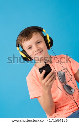 Happy child listening to music