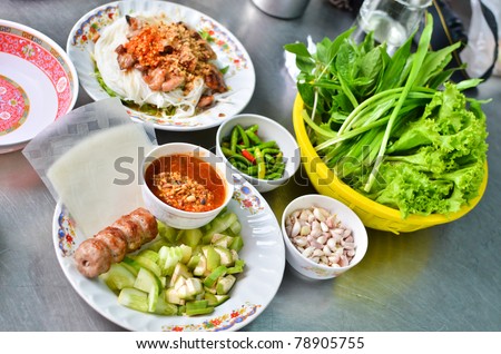 Fresh Vietnamese style food set , Grilled pork with vegetables and wrapping flour
