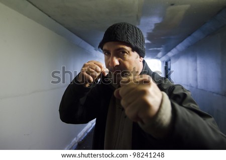 stock-photo-angry-man-punching-in-a-street-fight-real-people-copy-space-98241248.jpg