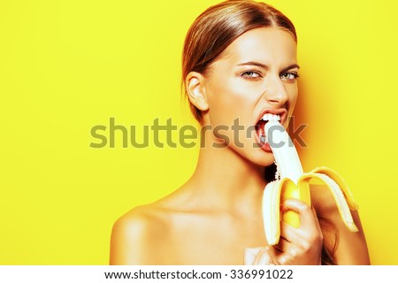 https://thumb9.shutterstock.com/display_pic_with_logo/67164/336991022/stock-photo-funny-young-woman-eating-banana-tropical-fruits-summer-concept-healthy-eating-336991022.jpg