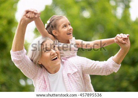 Grandmother with granddaughter in park
