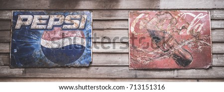 BANGKOK -THAILAND, September 3,2017 : Old condition vintage wall of Coca-Cola and Pepsi logos at museum Ban Bang Khen in Bangkok Thailand.