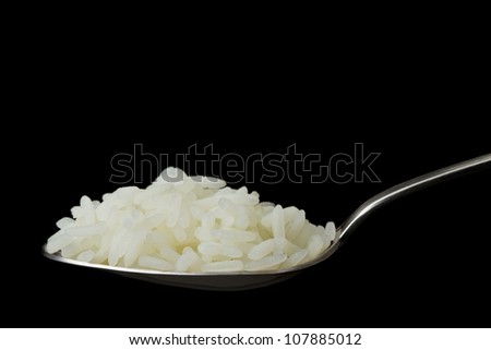 stock-photo-cooked-rice-in-spoon-on-isolated-black-107885012.jpg