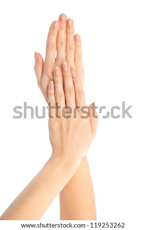 Beautiful woman hands with french manicure nails isolated on a white background