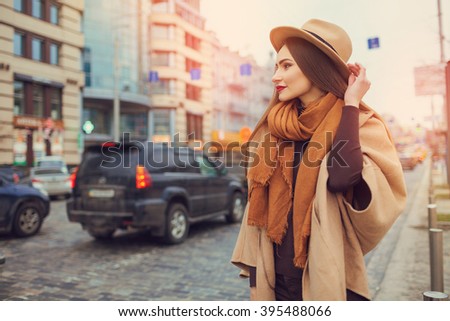 https://thumb9.shutterstock.com/display_pic_with_logo/701650/395488066/stock-photo-happy-young-pretty-woman-with-hat-walking-down-the-street-vacation-europe-395488066.jpg