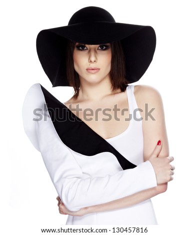 https://thumb9.shutterstock.com/display_pic_with_logo/71188/130457816/stock-photo-fashionable-woman-in-a-hat-posing-in-light-background-130457816.jpg