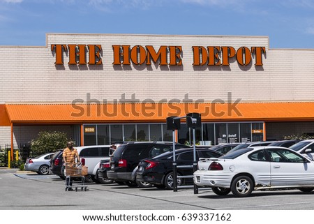 Customers enter a Home Depot store in Cary, North Carolina ...