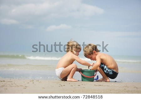 two children playing on beach