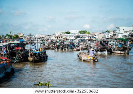MEKONG DELTA, VIETNAM - April 25, 2014 - Asian floating market on Mekong river in Vietnam
