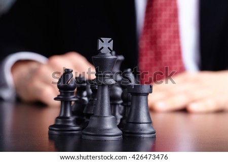 businessman playing chess game