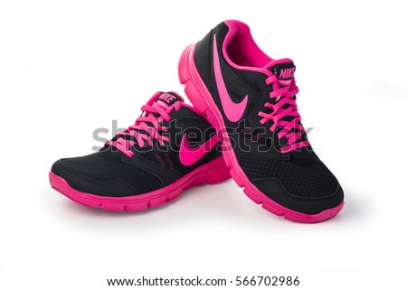 Chisinau, Moldova- May 27, 2015: Nike lady's - women's running shoes - sneakers - trainers, in gray and pink, showing the Nike swoosh logo and sole