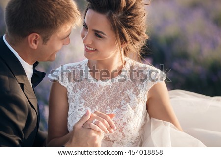 https://thumb9.shutterstock.com/display_pic_with_logo/745759/454018858/stock-photo-young-couple-in-love-bride-and-groom-wedding-day-in-summer-enjoy-a-moment-of-happiness-and-love-454018858.jpg