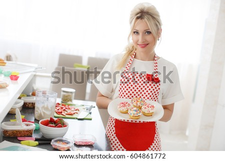 pretty young woman decorating cupcakes on her kitchen portrait of a beautiful female business owner - Woman Decorating Cupcakes pretty young woman decorating cupcakes on her kitchen portrait of a beautiful female business owner - Woman Decorating Cupcakes