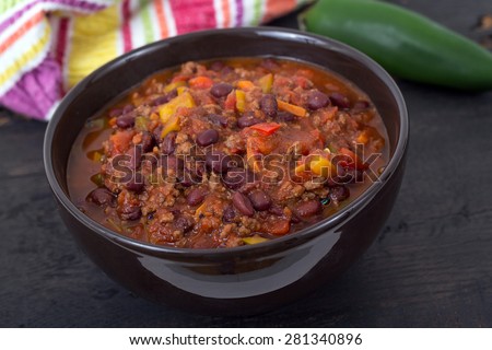 chili con carne beef chili on black table