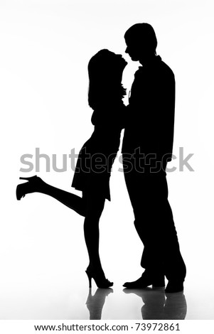 silhouette of kissing happy couple ready for your logo isolated on white background